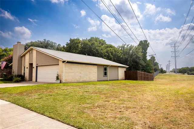 a house with yard in front of it