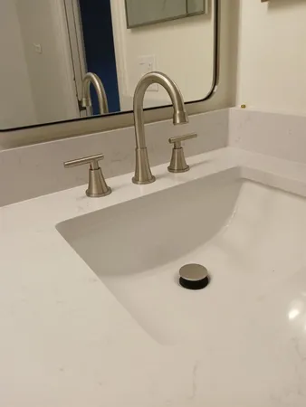 a view of a kitchen with microwave and a sink