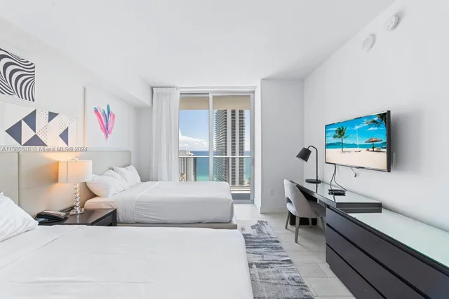 a bedroom with a bed and a desk