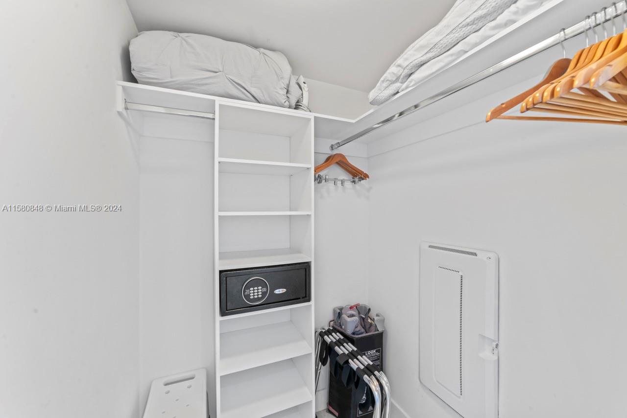 4010 South Ocean Drive, Unit R2505 Hollywood, FL 33019 - Photo 25 of 25 a view of walk in closet with clothes and shoes