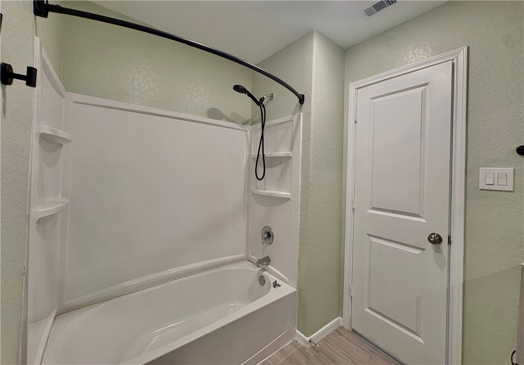 1109 Demeter Drive Portland, TX 78374 - Photo 15 of 18 a bathroom with a bathtub