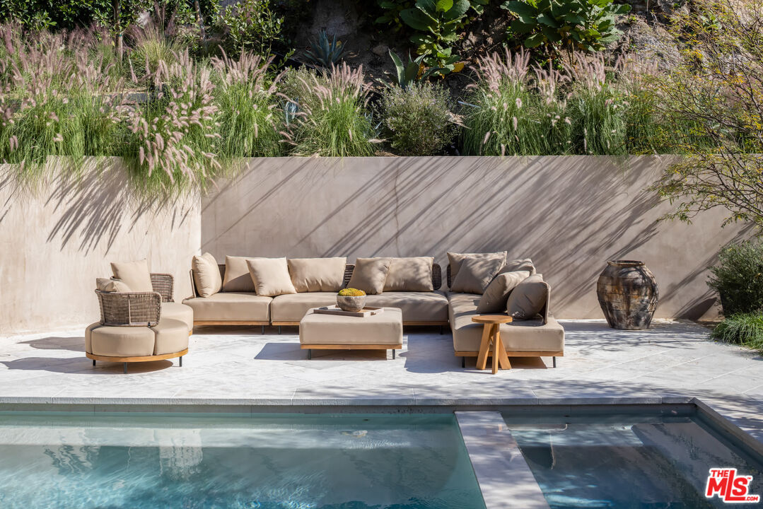 1600 Rising Glen Road Los Angeles, CA 90069 - Photo 11 of 28 a view of patio with couches table and chairs