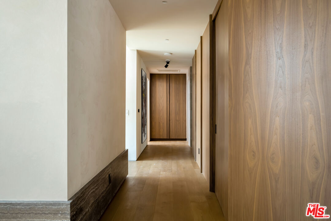 1600 Rising Glen Road Los Angeles, CA 90069 - Photo 16 of 28 a view of a hallway with wooden floor