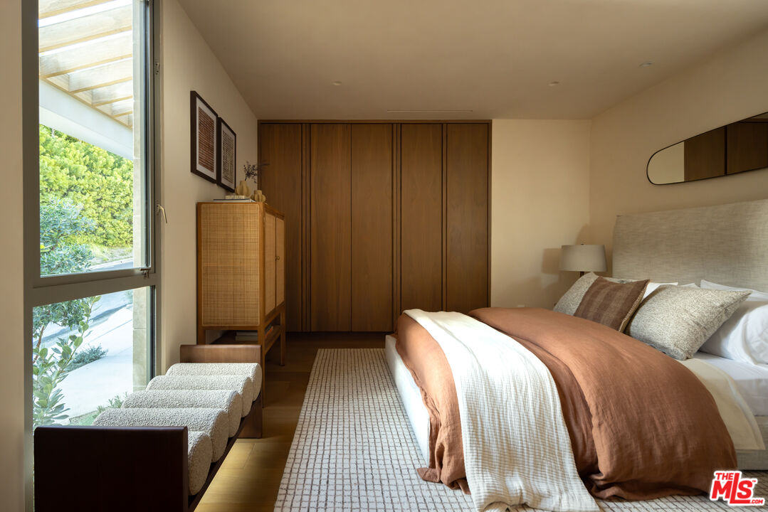 1600 Rising Glen Road Los Angeles, CA 90069 - Photo 26 of 28 a bedroom with a bed and a window