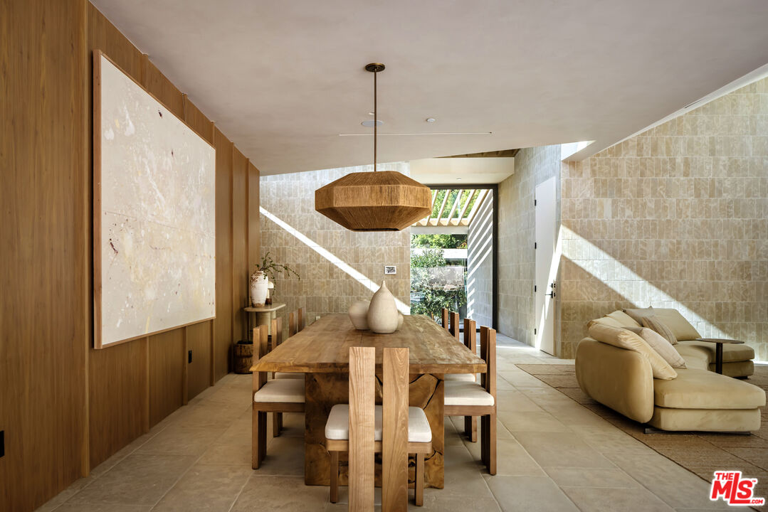 1600 Rising Glen Road Los Angeles, CA 90069 - Photo 5 of 28 a dining room with furniture and wooden floor