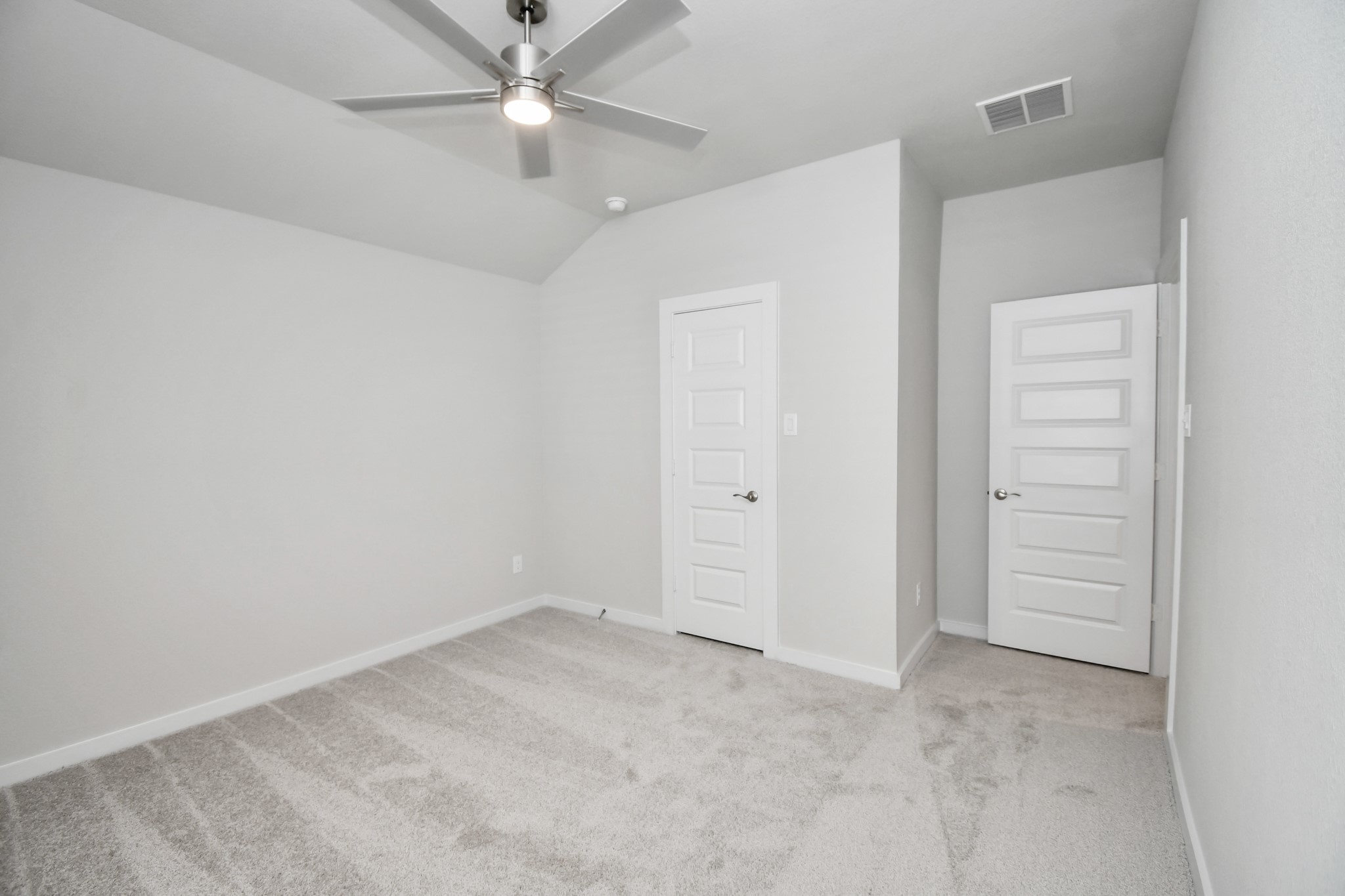 3038 Native Spg Drive Spring, TX 77373 - Photo 33 of 40 Generously sized secondary bedrooms featuring spacious closets, soft and inviting carpeting underfoot, large windows allowing plenty of natural light, and the added touch of privacy blinds for your personal retreat. Sample photo of completed home with similar floor plan. Actual colors and selections may vary.
