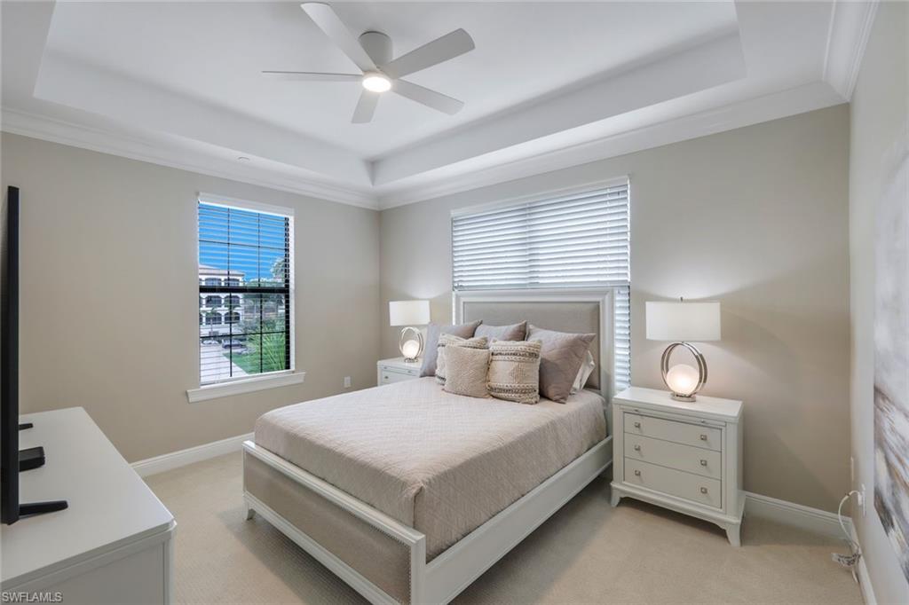 16445 Carrara Way, Unit 202 Naples, FL 34110 - Photo 14 of 35 a bedroom with a bed and a window