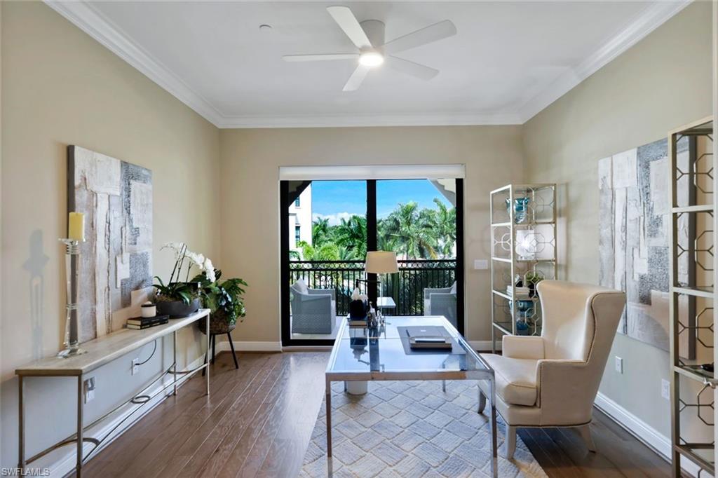 16445 Carrara Way, Unit 202 Naples, FL 34110 - Photo 16 of 35 a living room with furniture and a large window