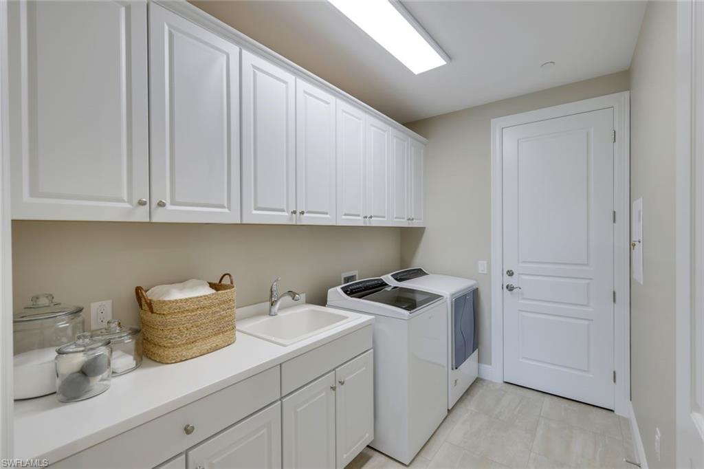 16445 Carrara Way, Unit 202 Naples, FL 34110 - Photo 18 of 35 a view of cabinets a sink and dishwasher in a white cabinet