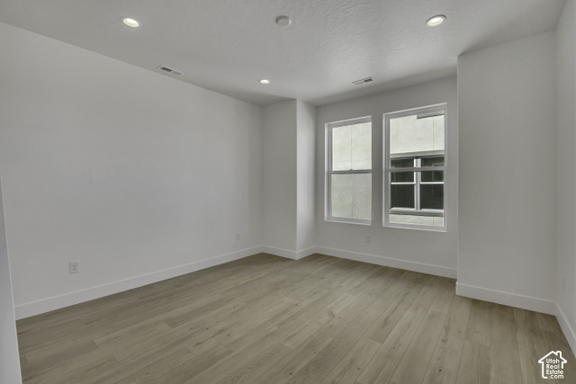 11041 South Freestone Road, Unit 130 South Jordan, UT 84009 - Photo 4 of 7 Recessed ceiling lighting with a neutral color palette, wood-finish flooring, and white trim