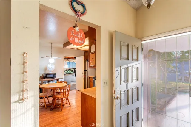 a view of a livingroom with furniture and a flat screen tv