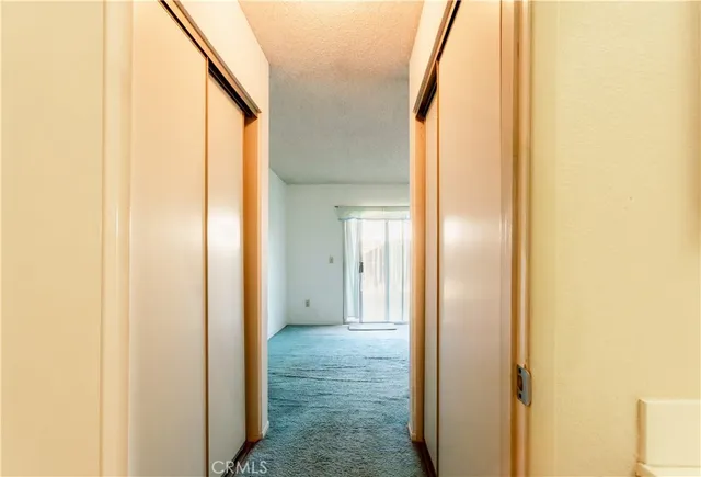 a view of a bathroom from a hallway
