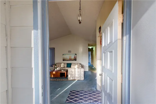a view of living room with furniture and a window