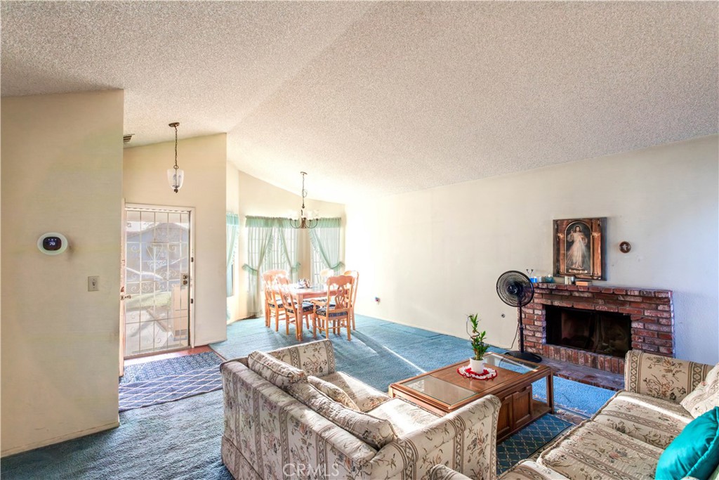 3579 Paine Drive Riverside, CA 92503 - Photo 7 of 31 a living room with furniture and a fireplace