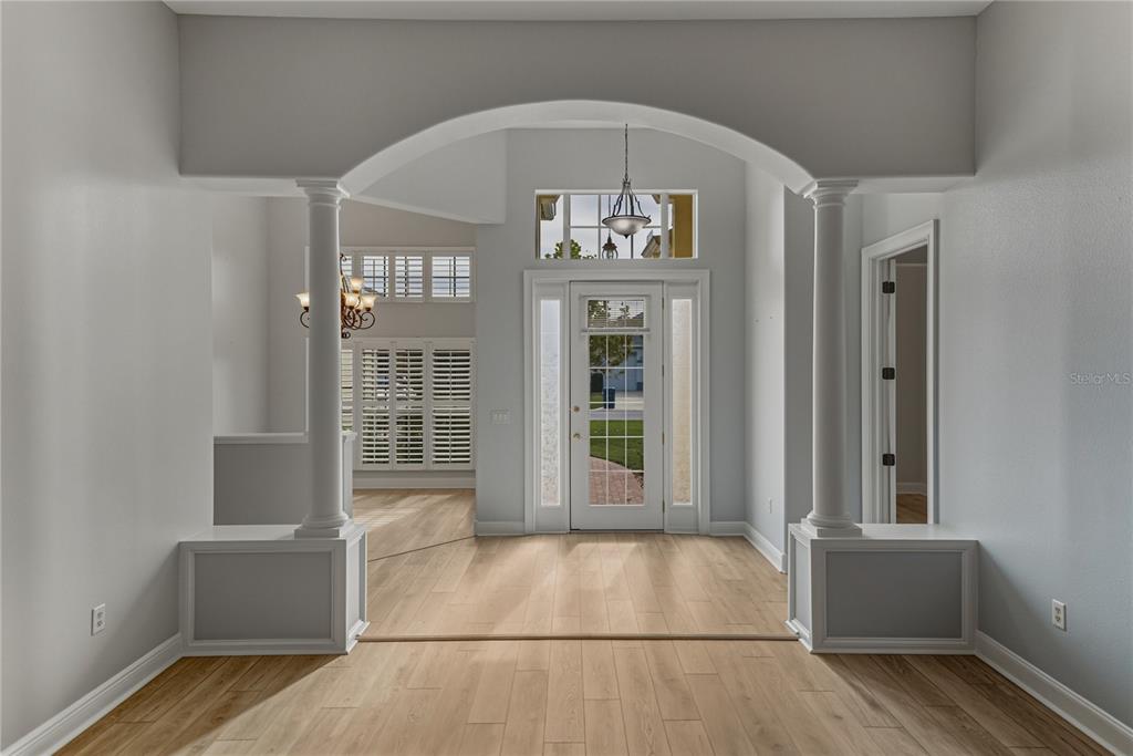 8725 Mississippi Run Spring Hill, FL 34613 - Photo 11 of 72 a view of an entryway with wooden floor