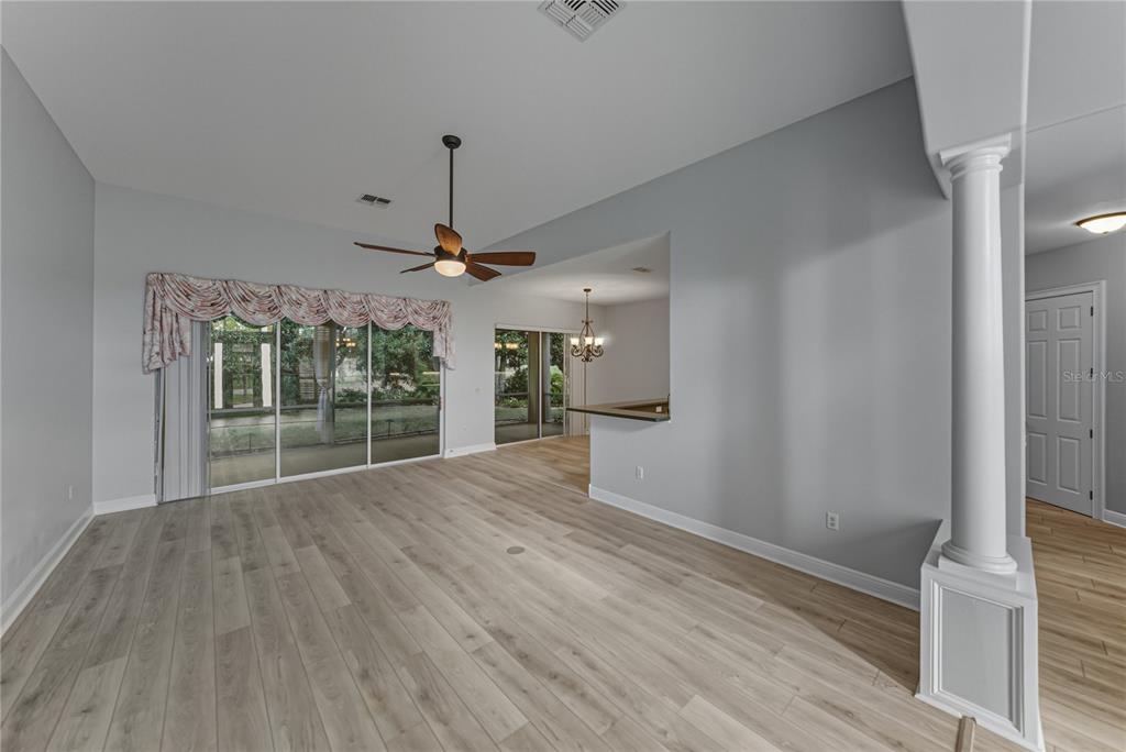 8725 Mississippi Run Spring Hill, FL 34613 - Photo 13 of 72 a view of empty room with wooden floor and fan