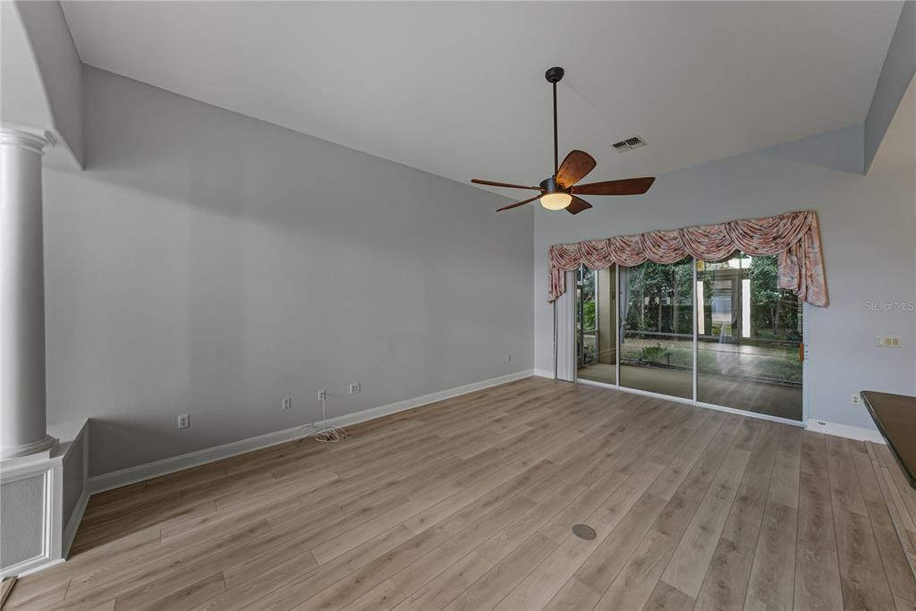 8725 Mississippi Run Spring Hill, FL 34613 - Photo 14 of 72 a view of room with a ceiling fan