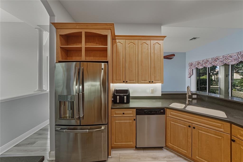 8725 Mississippi Run Spring Hill, FL 34613 - Photo 20 of 72 a kitchen with stainless steel appliances granite countertop a refrigerator and a sink