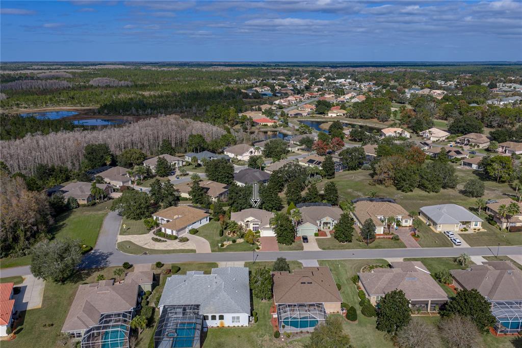 8725 Mississippi Run Spring Hill, FL 34613 - Photo 2 of 72 an aerial view of residential houses with outdoor space and street view