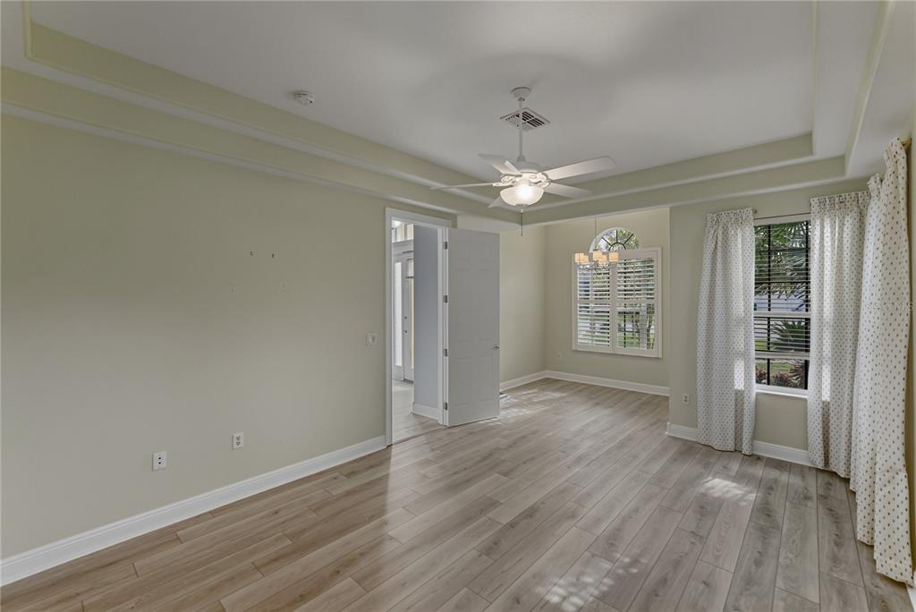 8725 Mississippi Run Spring Hill, FL 34613 - Photo 31 of 72 wooden floor in an empty room with a window