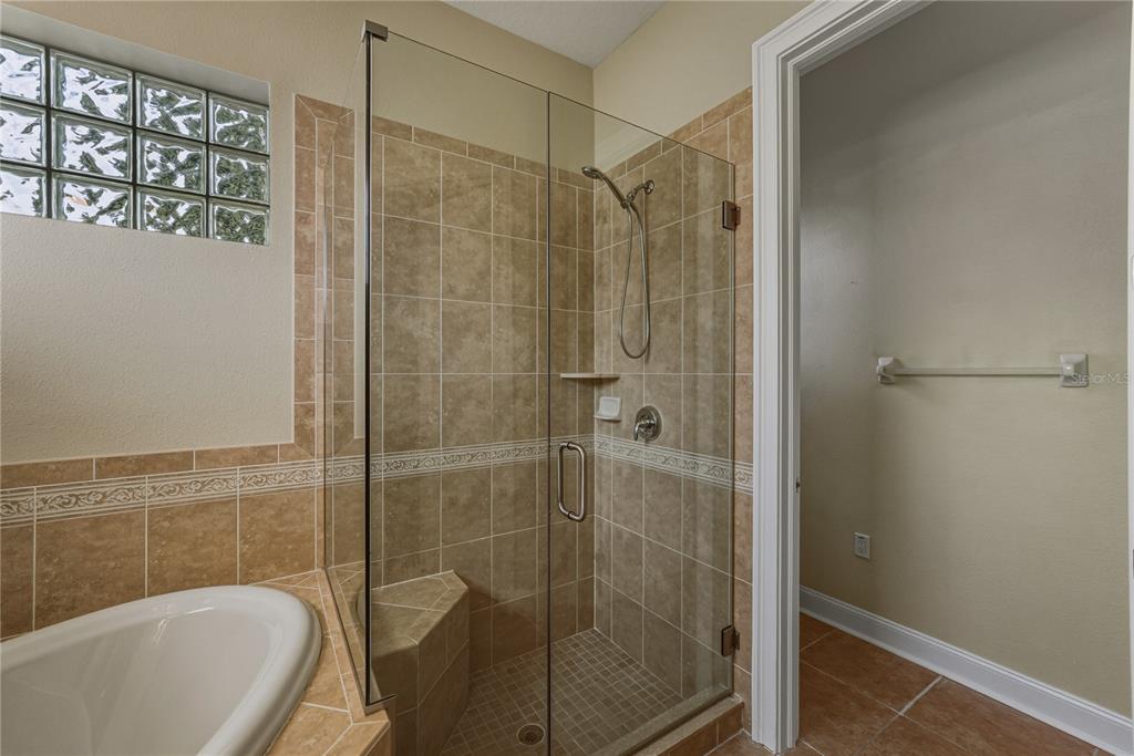 8725 Mississippi Run Spring Hill, FL 34613 - Photo 36 of 72 a bathroom with a shower and a sink