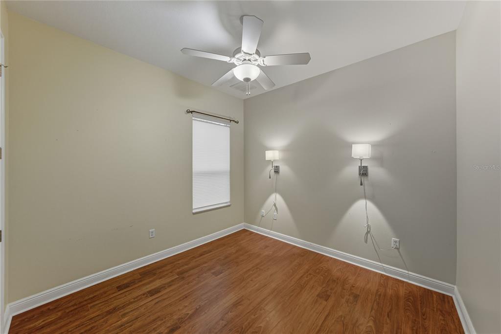 8725 Mississippi Run Spring Hill, FL 34613 - Photo 39 of 72 wooden floor in an empty room with a window