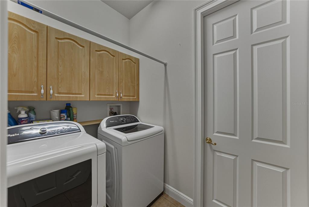 8725 Mississippi Run Spring Hill, FL 34613 - Photo 45 of 72 a view of storage and utility room with washer and dryer