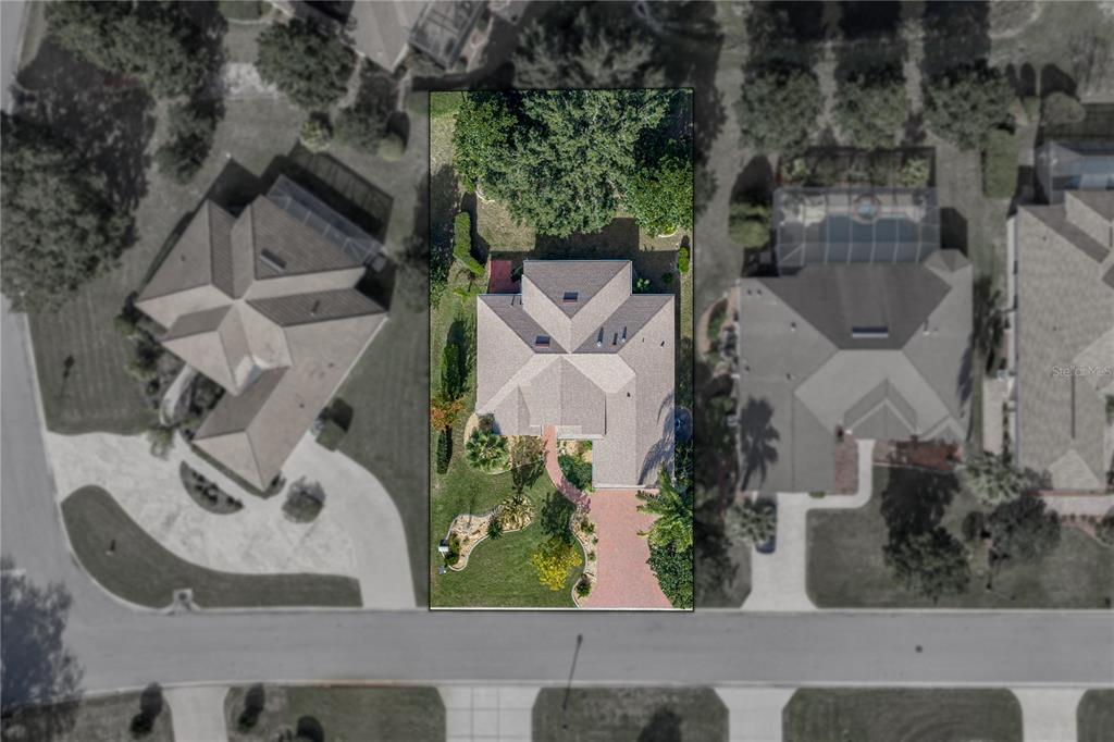 8725 Mississippi Run Spring Hill, FL 34613 - Photo 5 of 72 an aerial view of a garden with plants