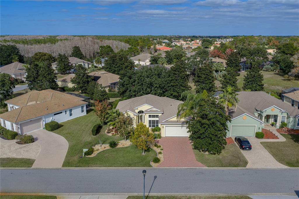 8725 Mississippi Run Spring Hill, FL 34613 - Photo 6 of 72 an aerial view of a house with a yard and lake view