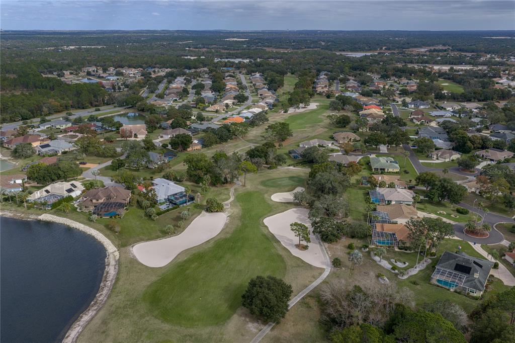 8725 Mississippi Run Spring Hill, FL 34613 - Photo 66 of 72 an aerial view of a house with a yard
