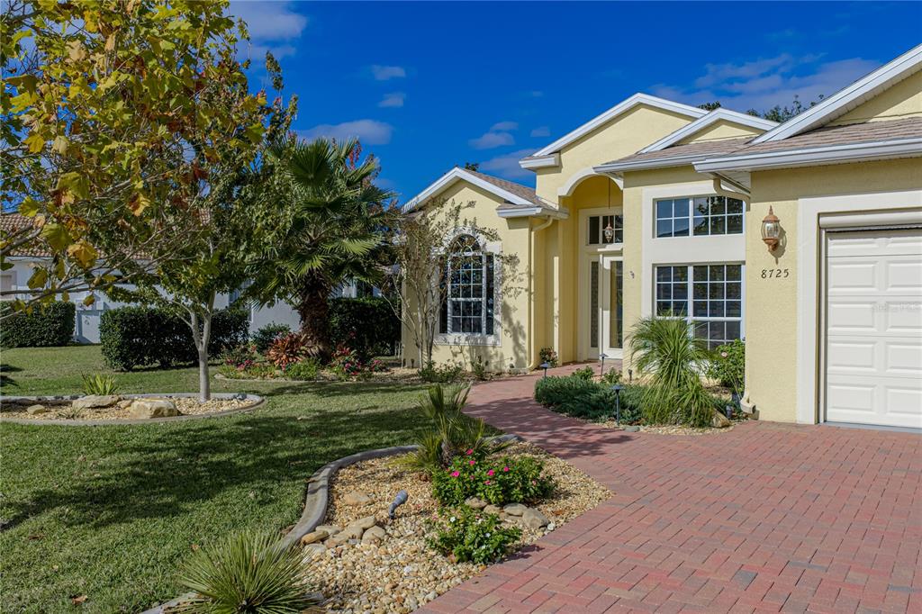 8725 Mississippi Run Spring Hill, FL 34613 - Photo 9 of 72 a front view of a house with a yard