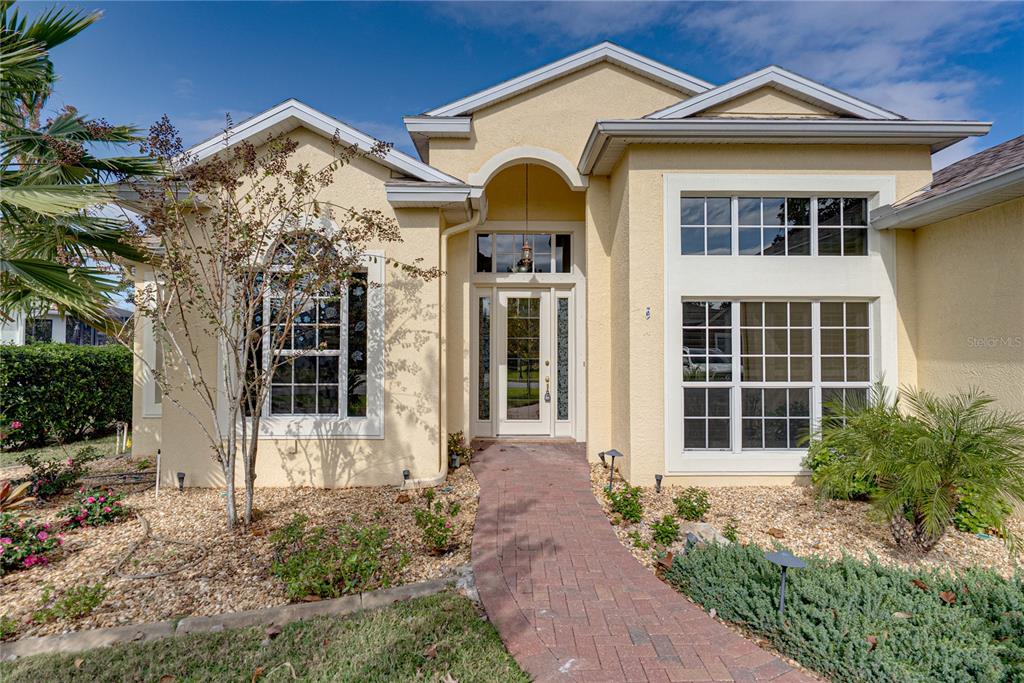 8725 Mississippi Run Spring Hill, FL 34613 - Photo 10 of 72 front view of a house with a yard