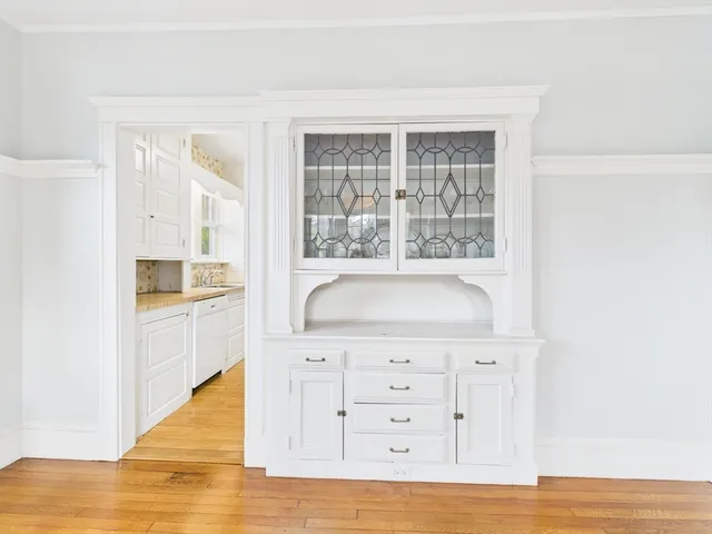 a kitchen with a sink and a refrigerator