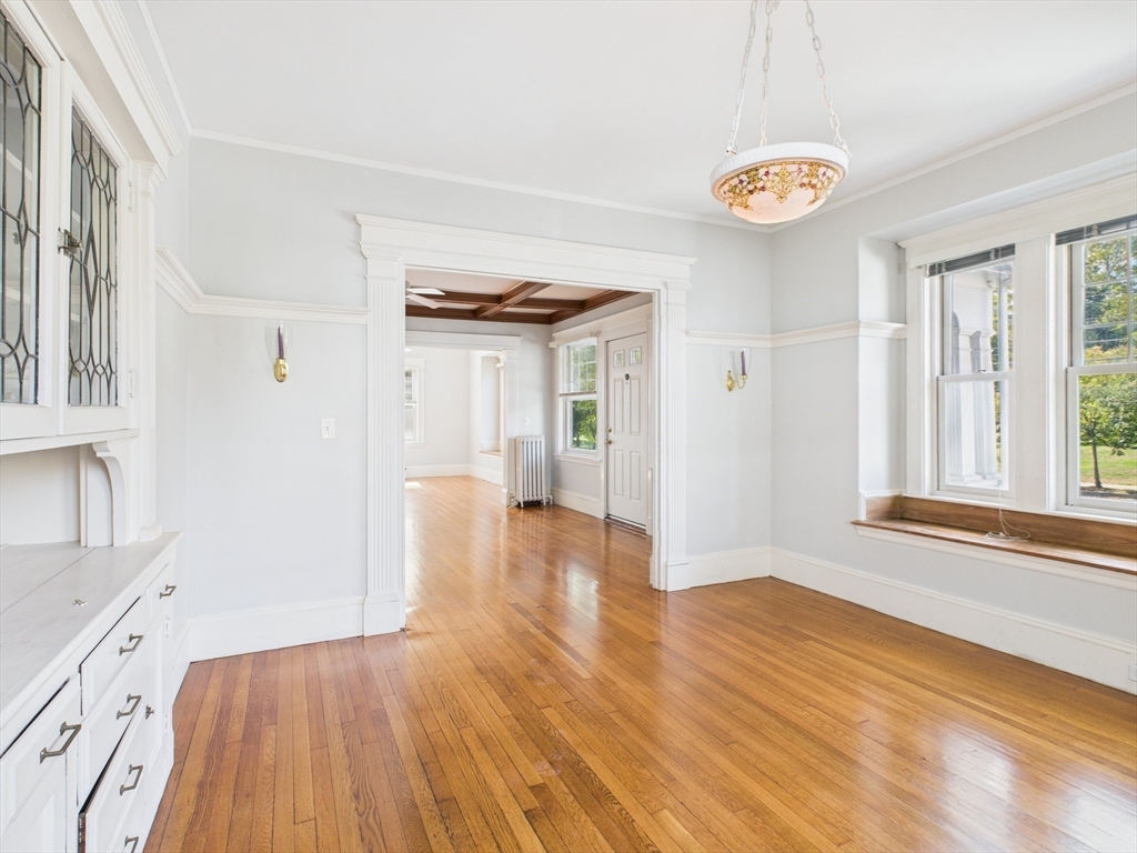 1120 Centre Street, Unit 1 Newton, MA 02459 - Photo 15 of 34 a view of a room with wooden floor and window