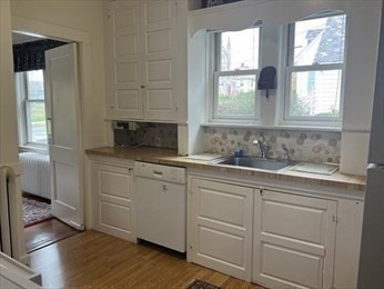 1120 Centre Street, Unit 1 Newton, MA 02459 - Photo 21 of 34 a bathroom with a sink and a window