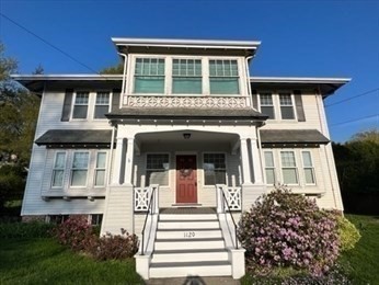 1120 Centre Street, Unit 1 Newton, MA 02459 - Photo 28 of 34 front view of a house with a small yard