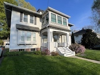 1120 Centre Street, Unit 1 Newton, MA 02459 - Photo 30 of 34 a front view of a house with a yard