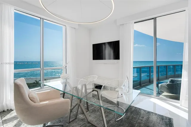 a bedroom with a bed and a chair