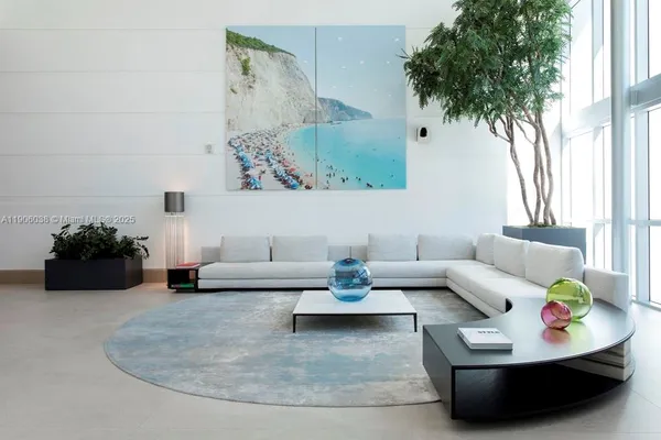 a view of a swimming pool with furniture