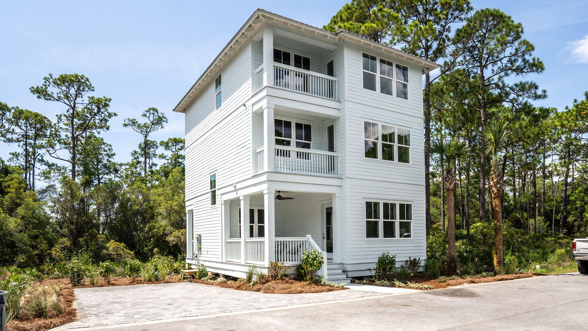 393 Redbud Ln Inlet Beach Inlet Beach, FL 32461 - Photo 1 of 46 a front view of a house with a yard
