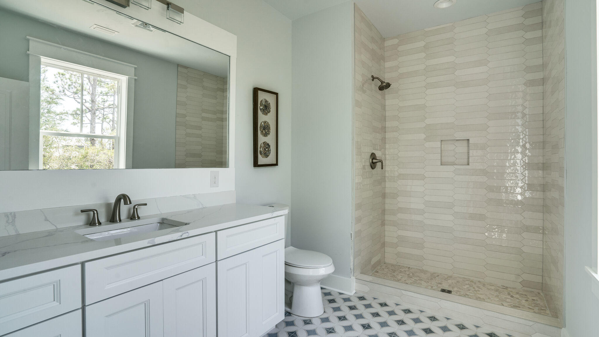393 Redbud Ln Inlet Beach Inlet Beach, FL 32461 - Photo 16 of 46 a bathroom with a sink toilet a shower and a mirror