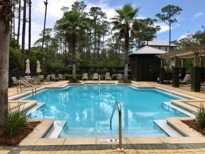 393 Redbud Ln Inlet Beach Inlet Beach, FL 32461 - Photo 44 of 46 a swimming pool with outdoor seating and yard