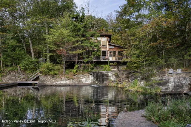 a view of house with a lake view