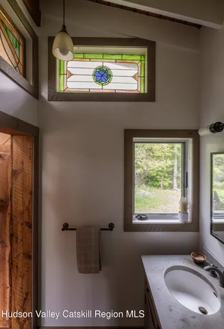 a view of two chairs in the balcony