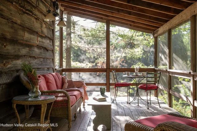 a dining room with furniture water view and mountain view
