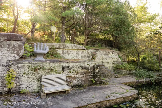 a view of a chairs and table in the balcony