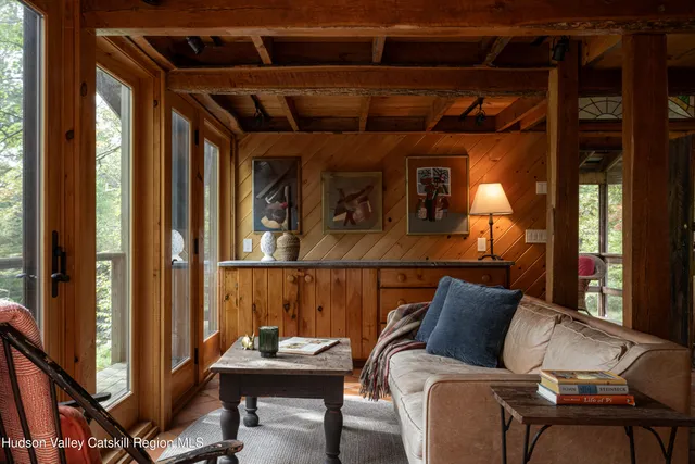 a view of a balcony with chair and wooden floor