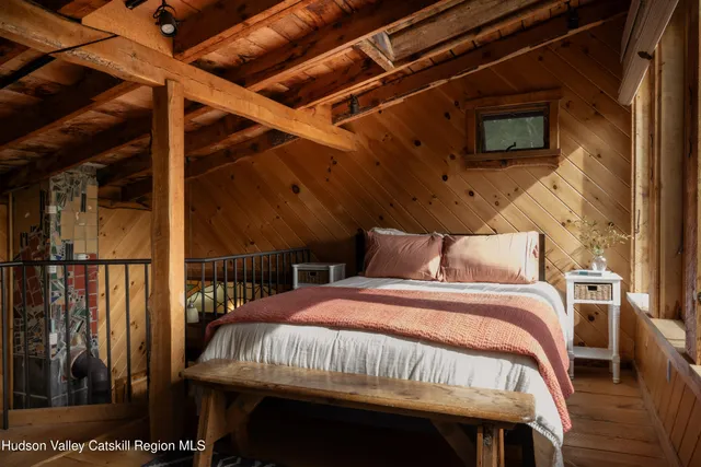 a view of a living room and a large window with backyard view