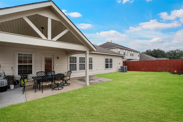 a front view of house with yard and outdoor seating