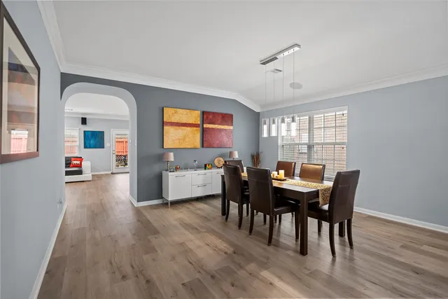 a view of a dining room with furniture and wooden floor